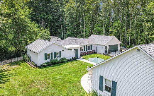 country home on 4 acres with private lake frontage Michigan